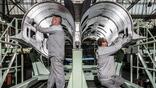 workers building rafale parts