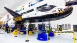 Sierra Space Caption: Dream Chaser Tenacity in its processing hangar at NASA's Kennedy Space Center in August 2025.