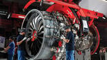 two people working on a CFM International Leap engine