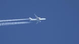 klm aircraft in flight creating contrails
