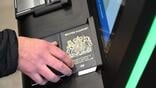 traveler scanning his passport with the EES system.