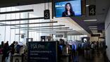 Airport monitor with Kristi Noem