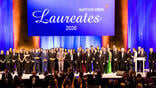 Laureates group standing on stage